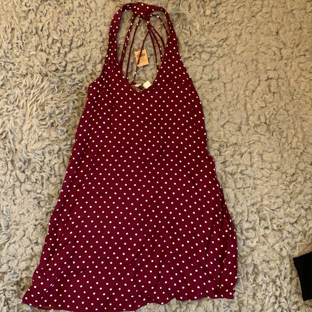 American eagle strappy back mini dress with white polka dots on maroon.